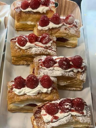 Fresh raspberry cream pastries at the bakery
