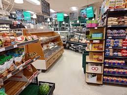 General store aisles stocked with groceries and treats